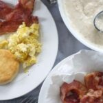 country breakfast with bacon eggs biscuits and gravy