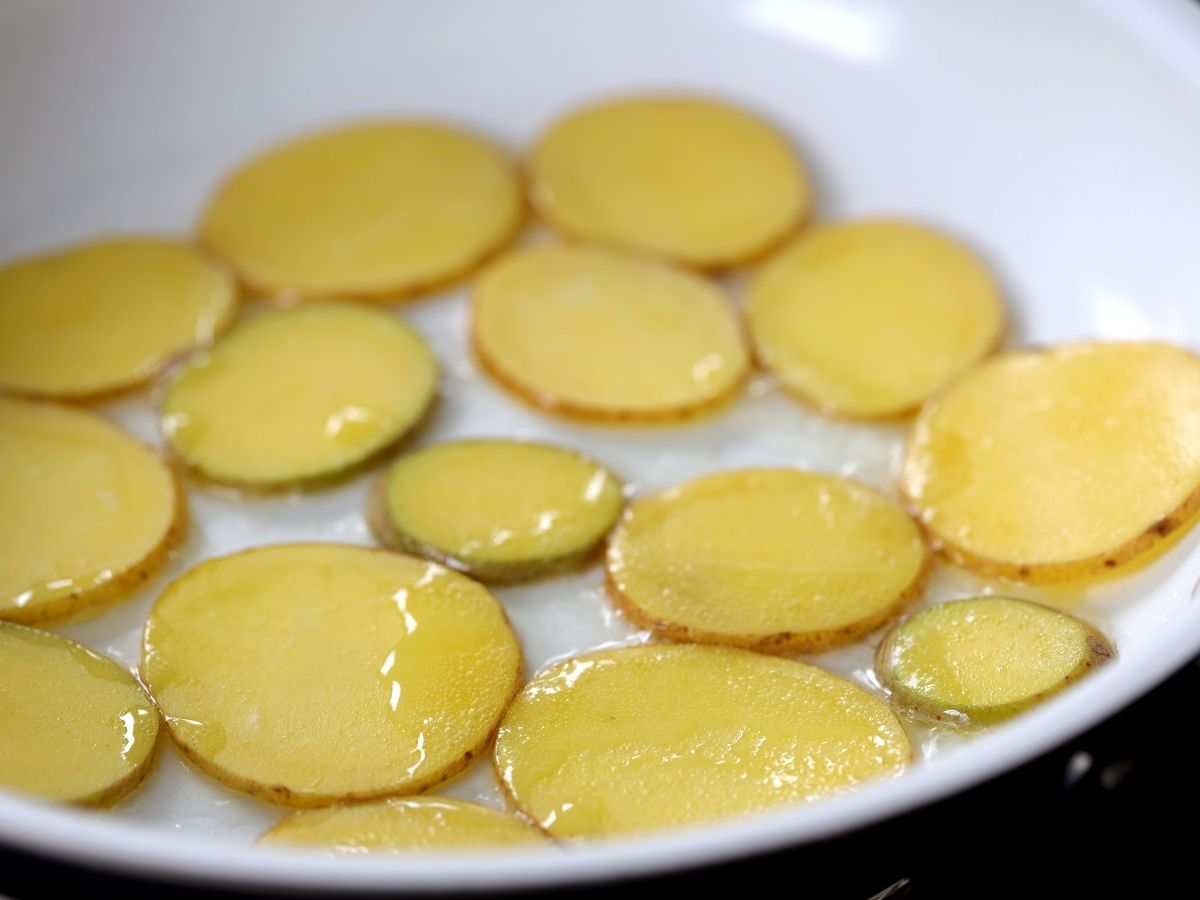 potatoes in a skillet with oil