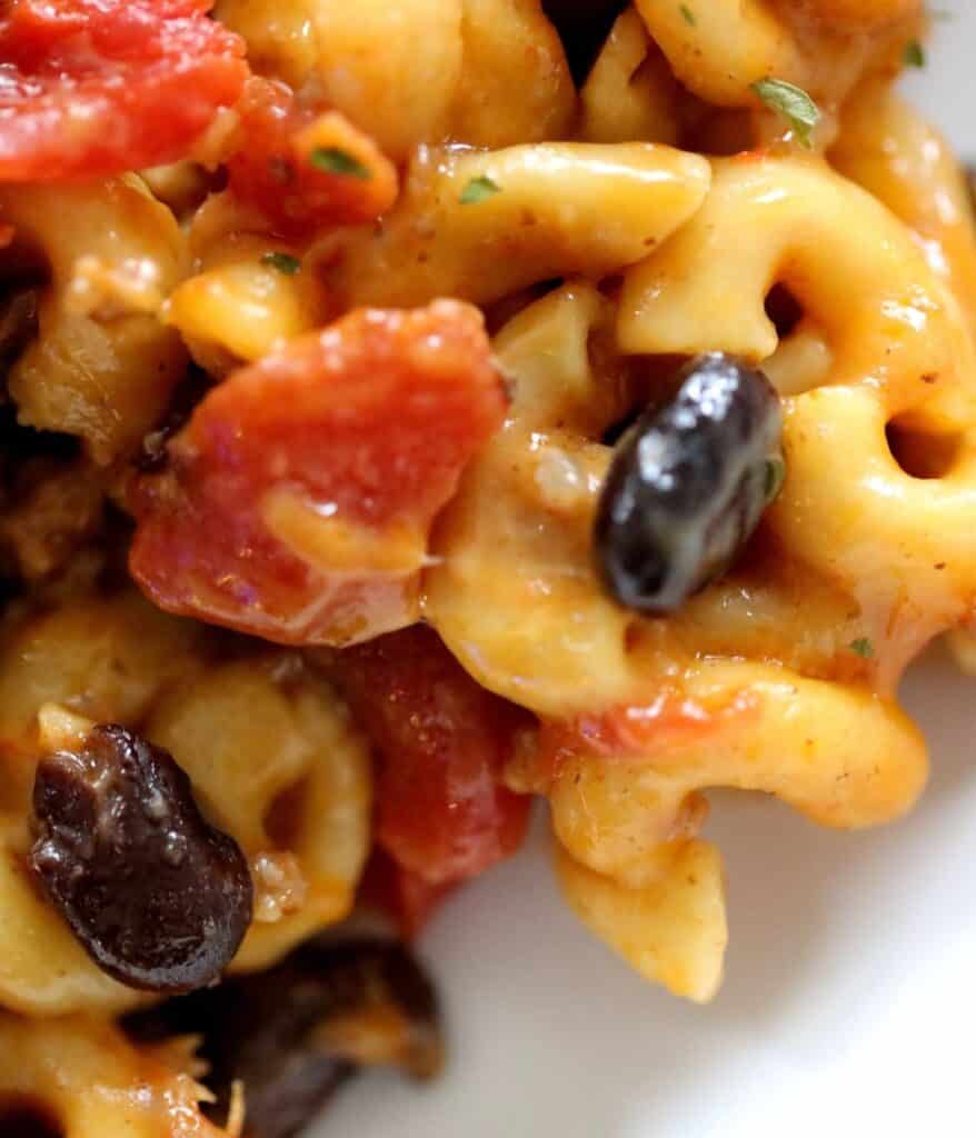 chili mac and cheddar cheese with black beans