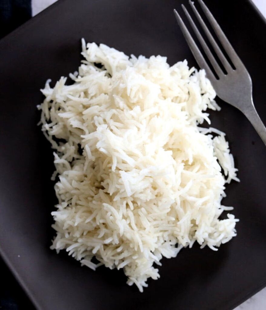 soft and fluffy basmati rice on plate with fork
