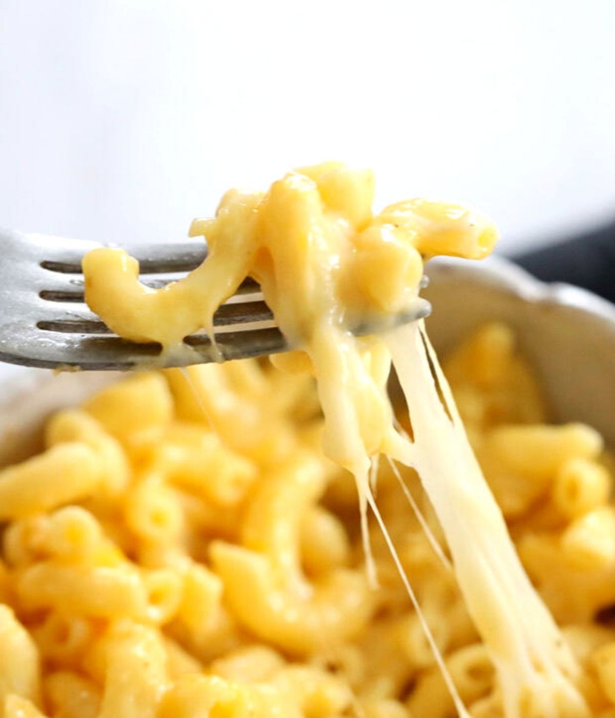 cheese pull with fork stretchy creamy macaroni and cheese