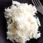 soft and fluffy basmati rice on plate with fork