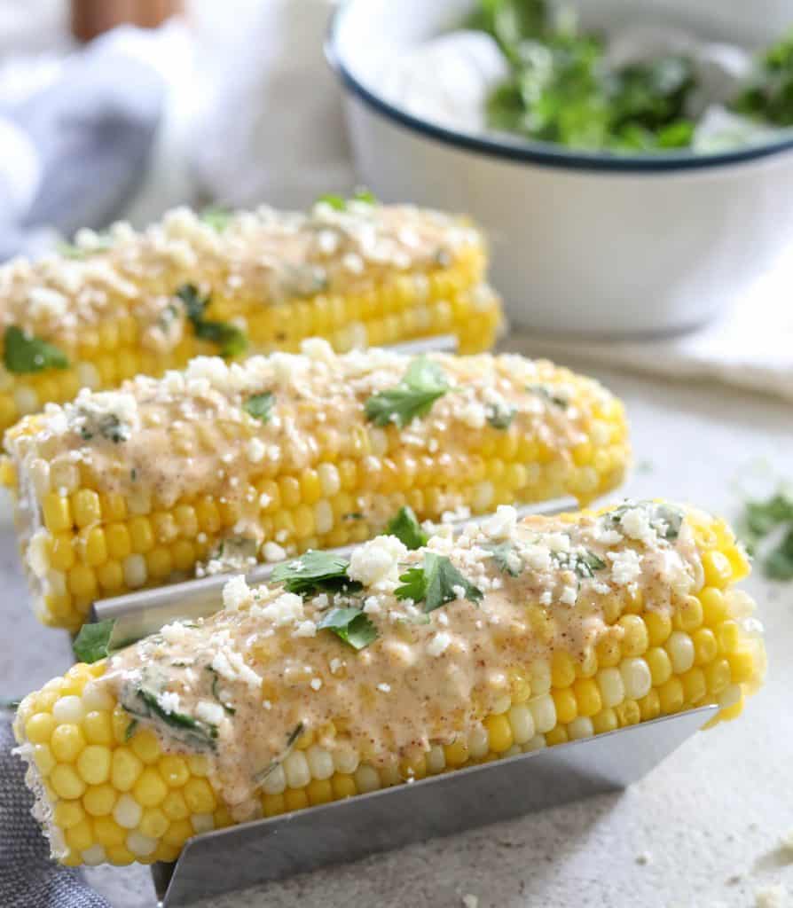 Mexican street corn on table with ingredients