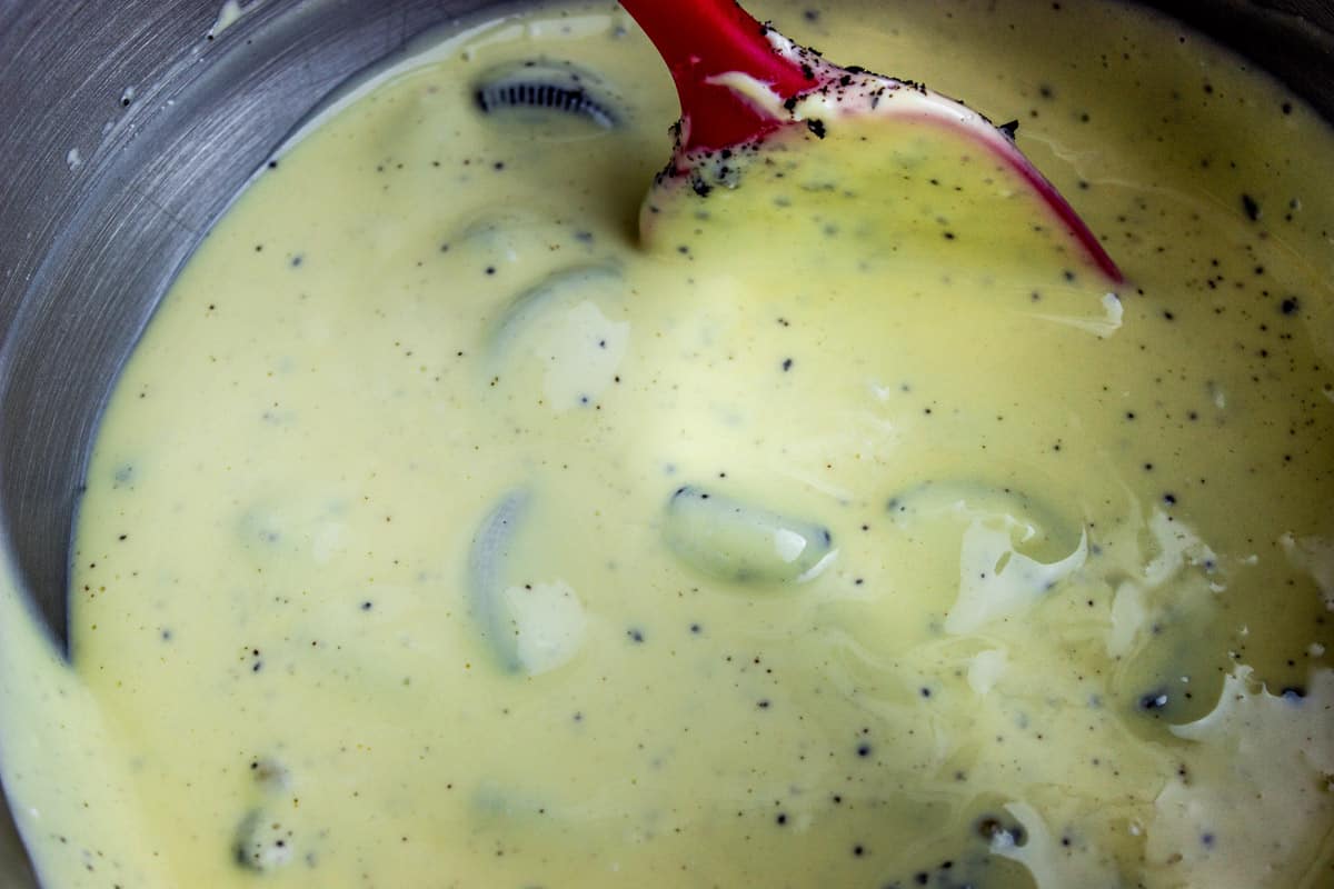 oreo cheesecake batter in a large bowl with spatula