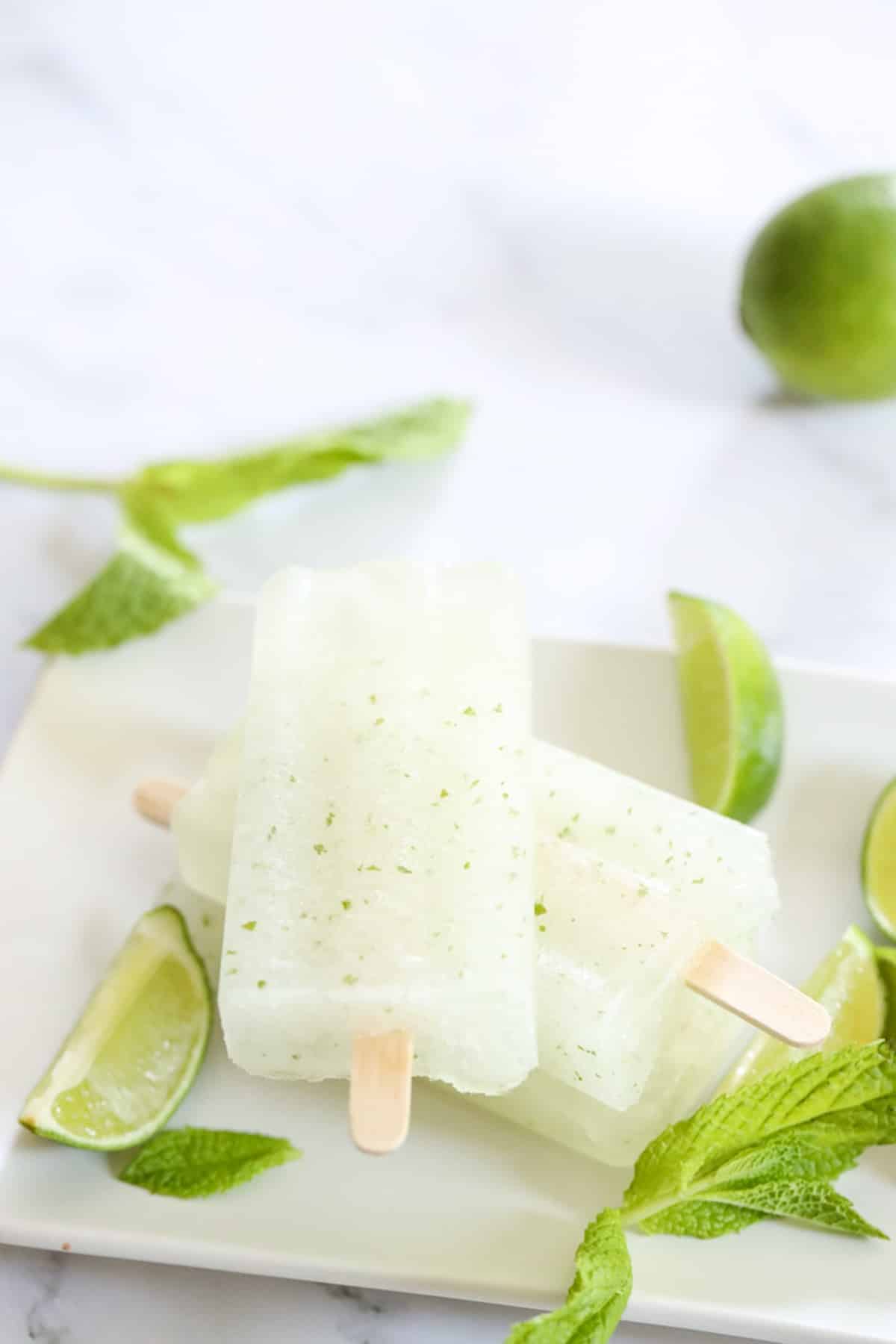 two mojito popsicles on a plate