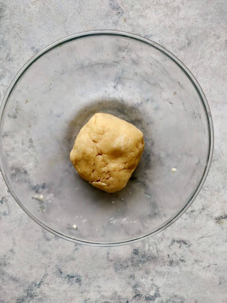 forming dough ball in a bowl