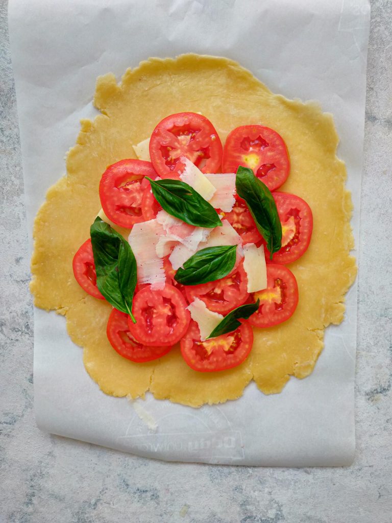 adding basil to galette