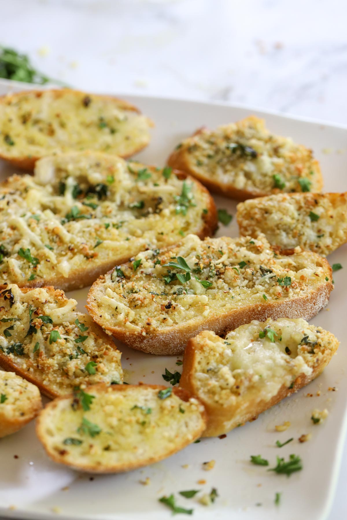 pieces of garlic bread lying on a plate