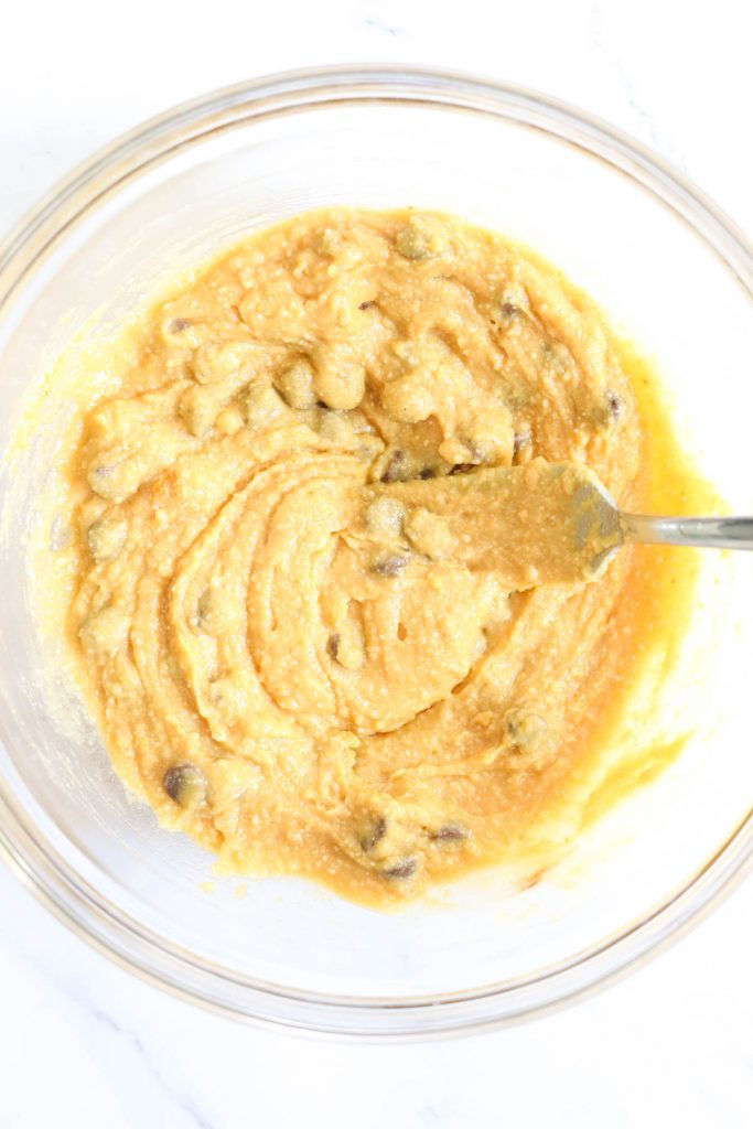 Mixing cookie batter in a bowl with a fork