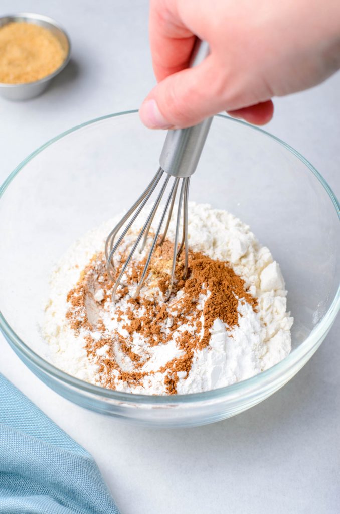 dry ingredients in a bowl, including cinnamon and flour