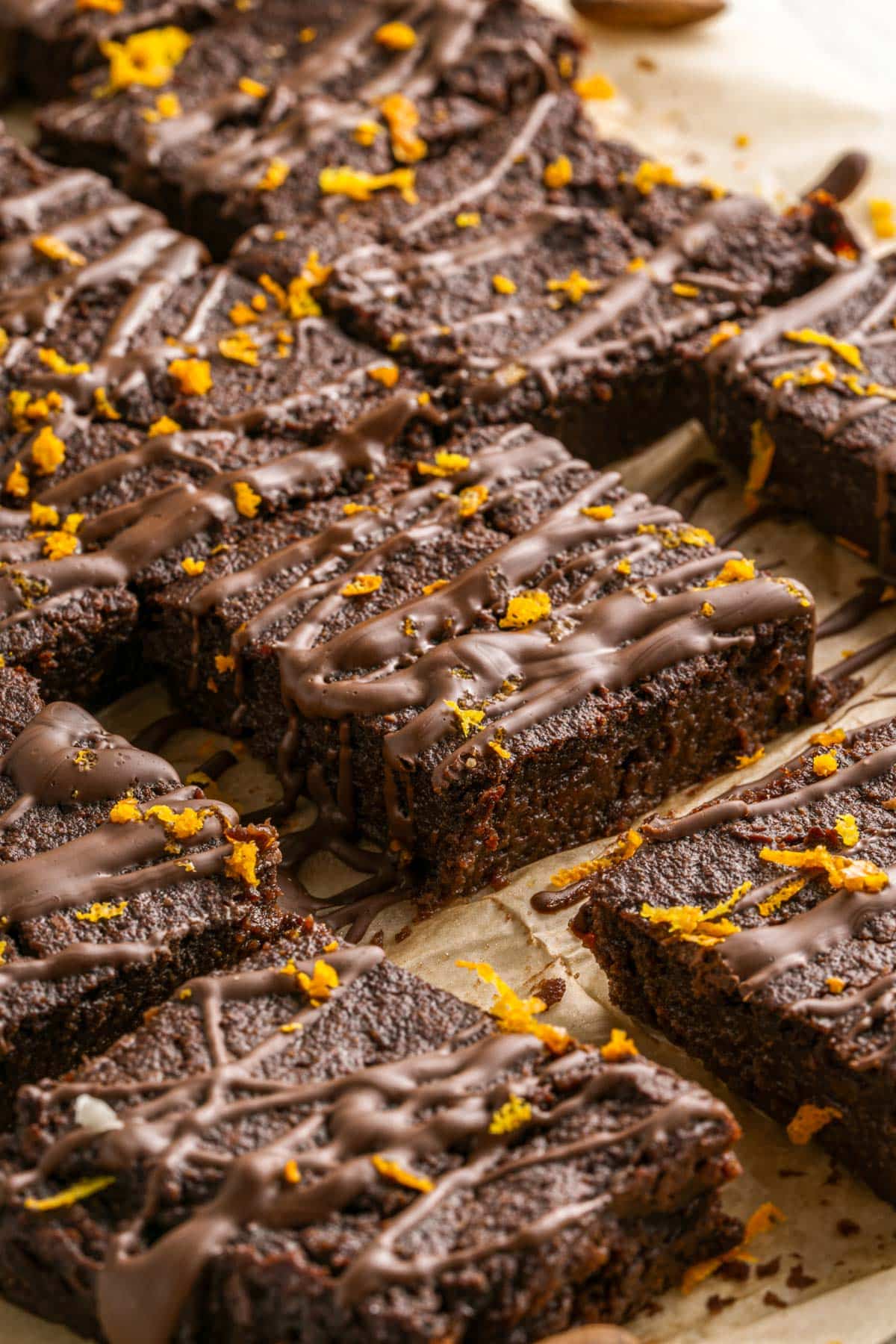 baking sheet with several brownies and orange zest