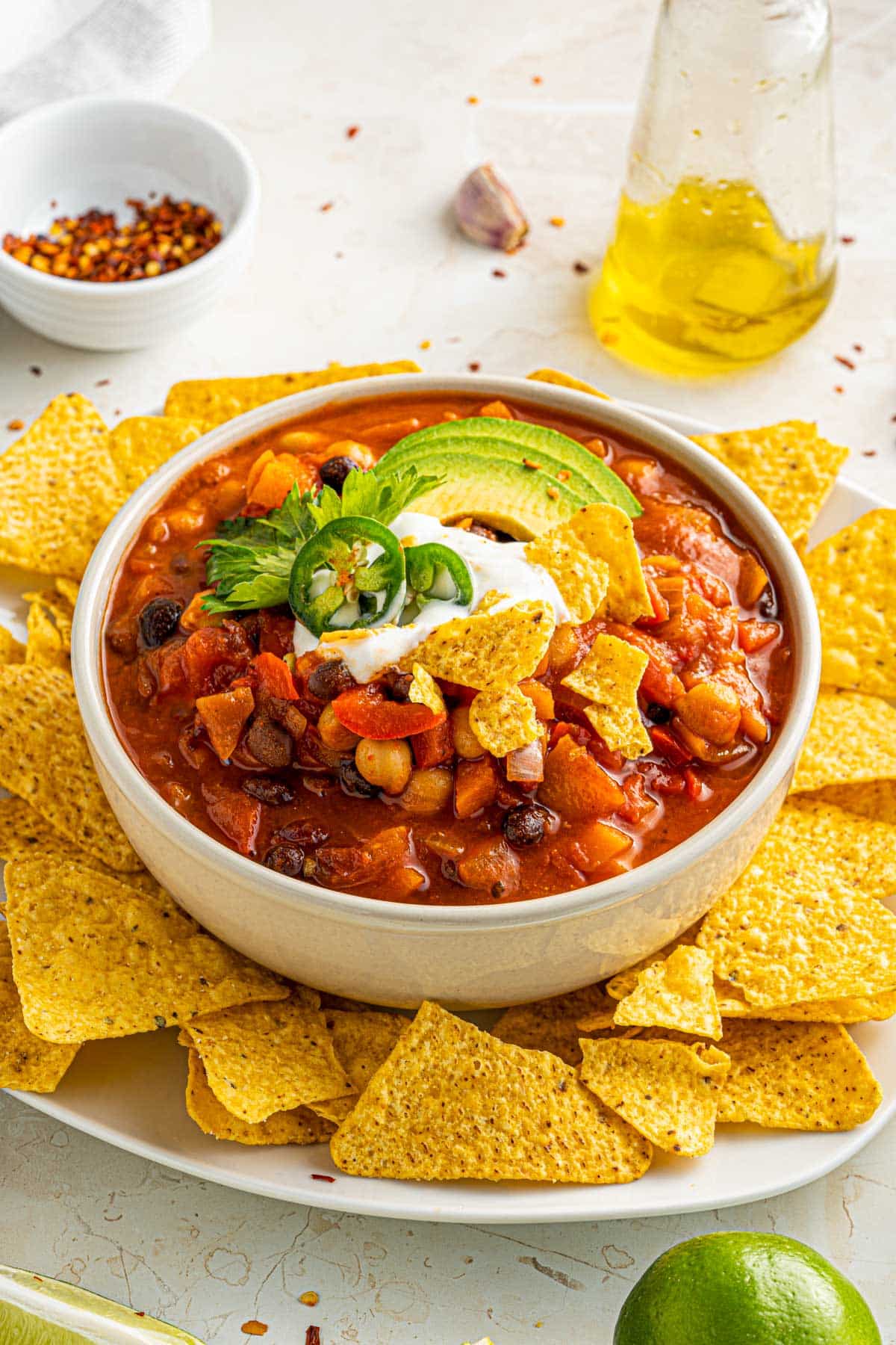 vegetarian smoky chili with tortilla chips, sour cream and avocado toppings