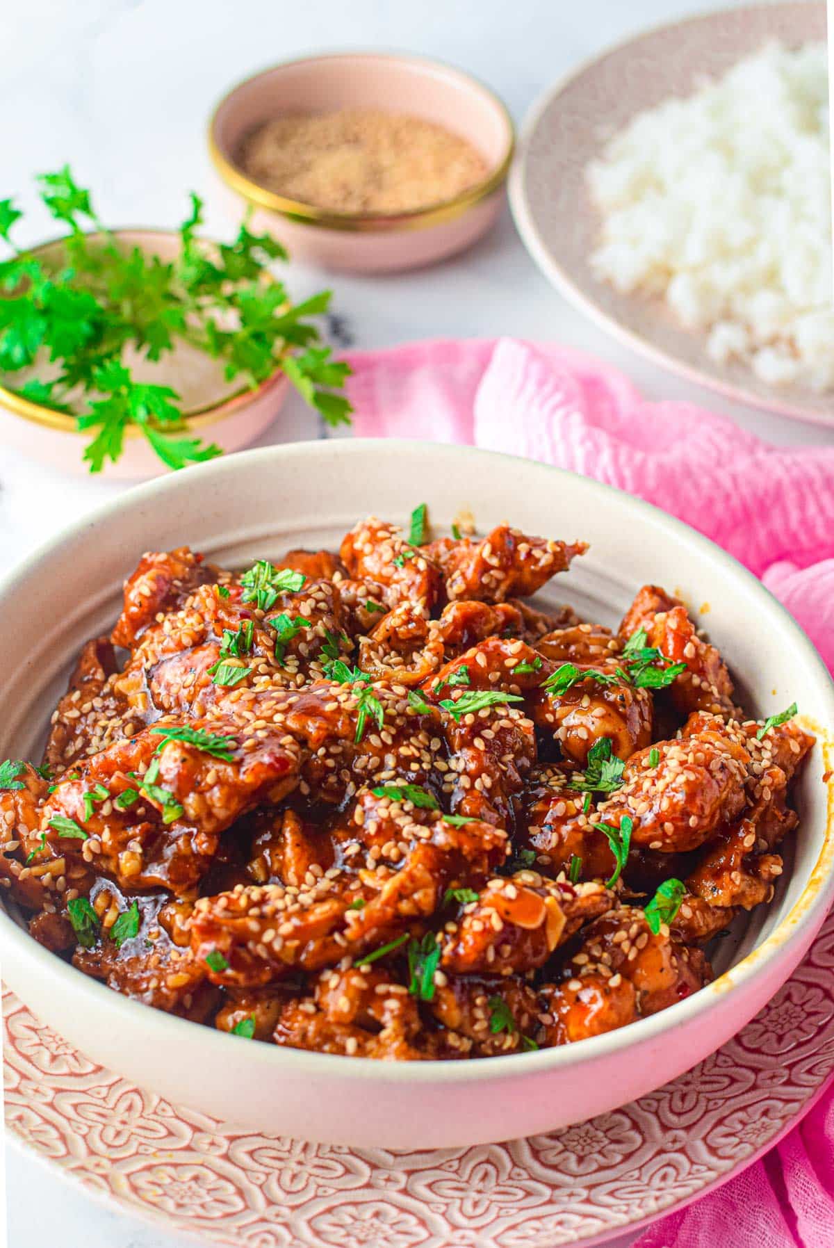 bowl of sesame chicken with rice