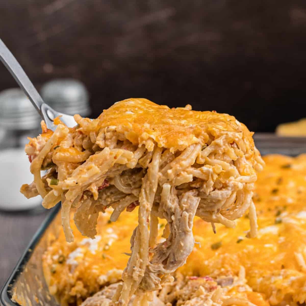creamy baked chicken spaghetti in a serving dish