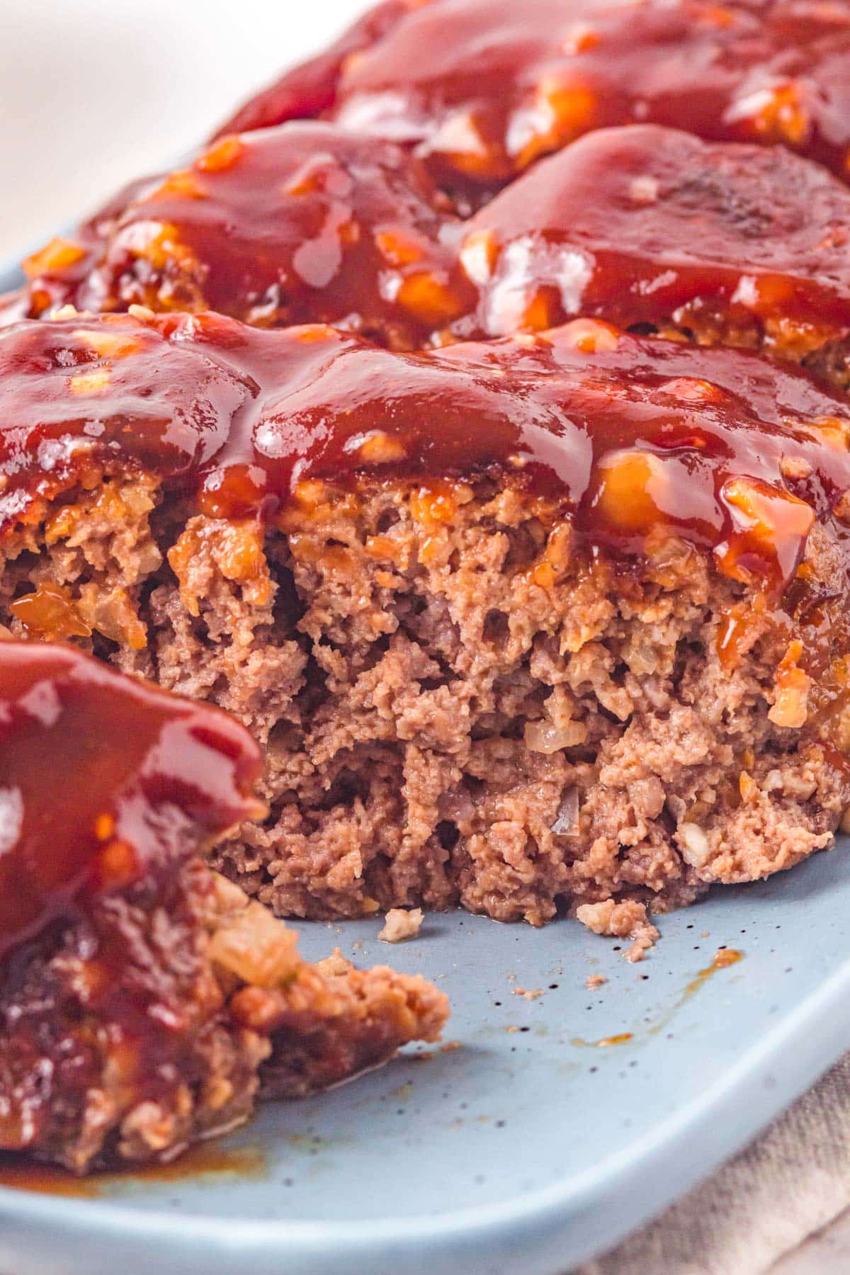 cutting into a juicy meatloaf slice