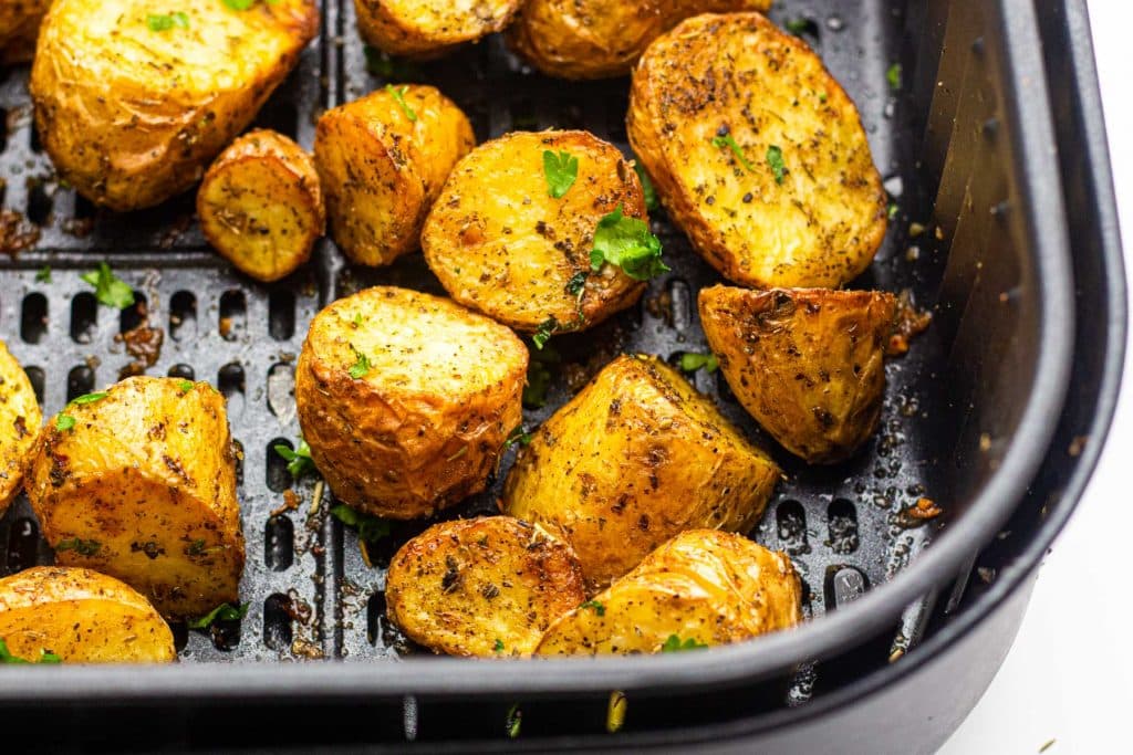 roasted potatoes in an air fryer basket