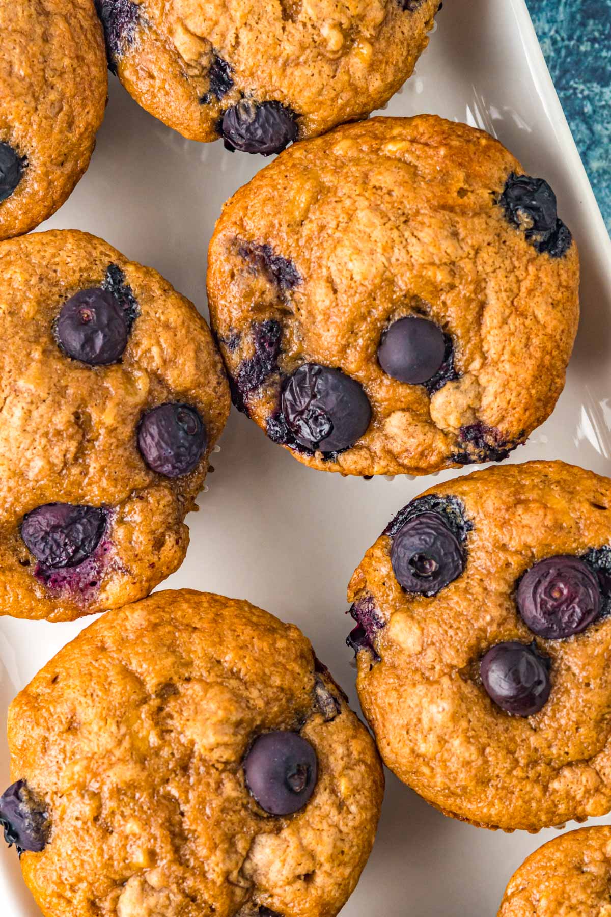 overhead view of muffins with texture and blueberries on top