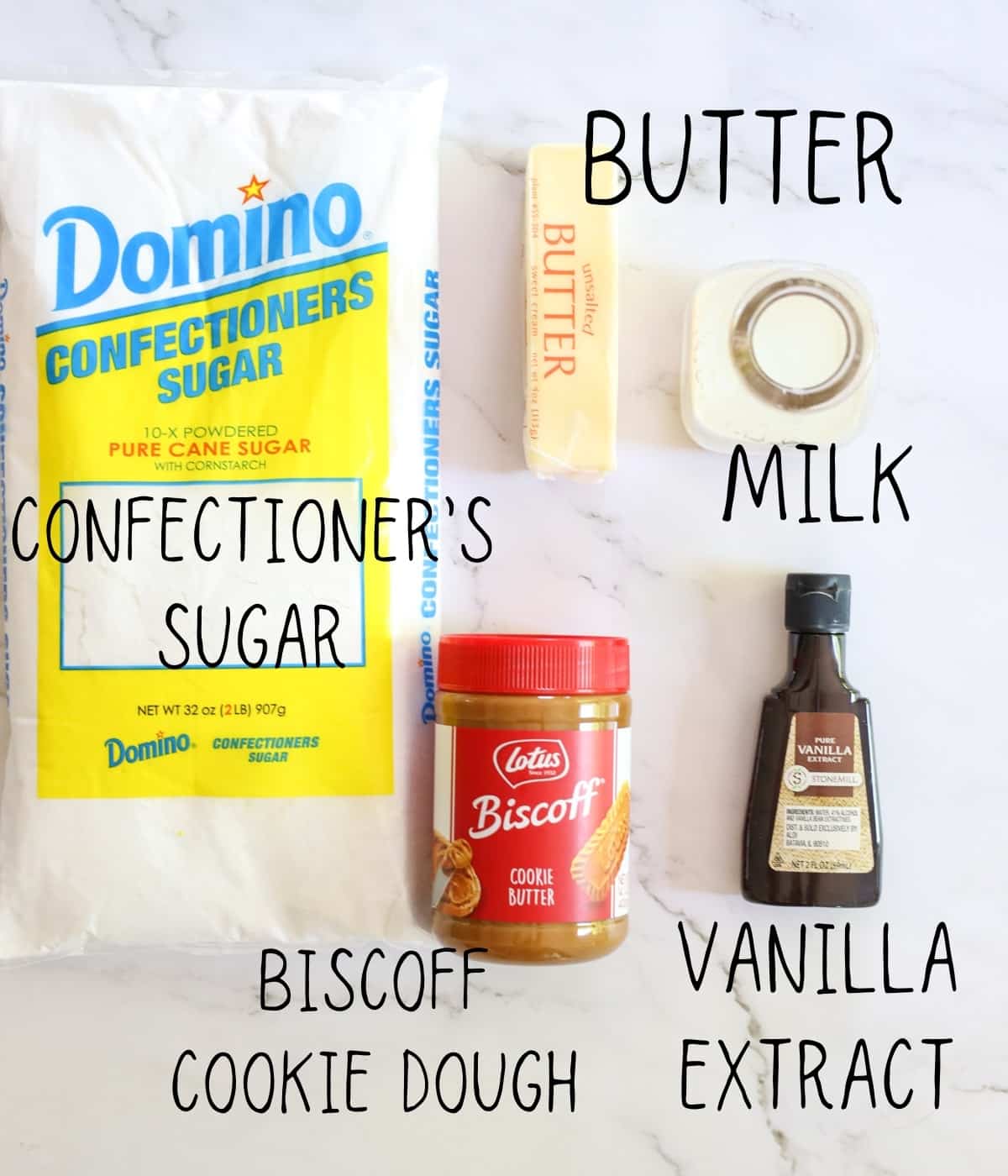 ingredients for Biscoff cookie butter fudge, including vanilla extract, powdered sugar, butter, and milk