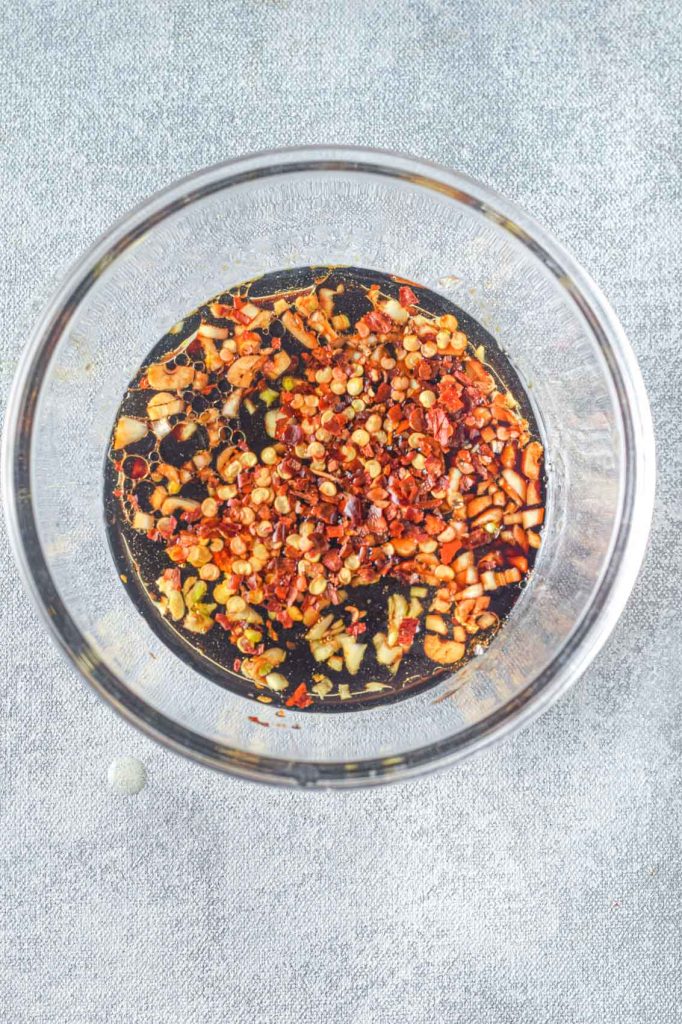 bowl of teriyaki sauce with red pepper flakes