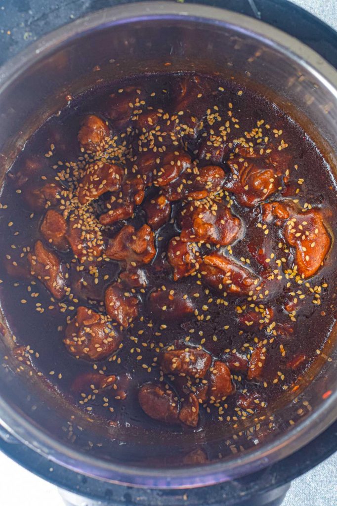 thick teriyaki sauce in the instant pot with chopped chicken