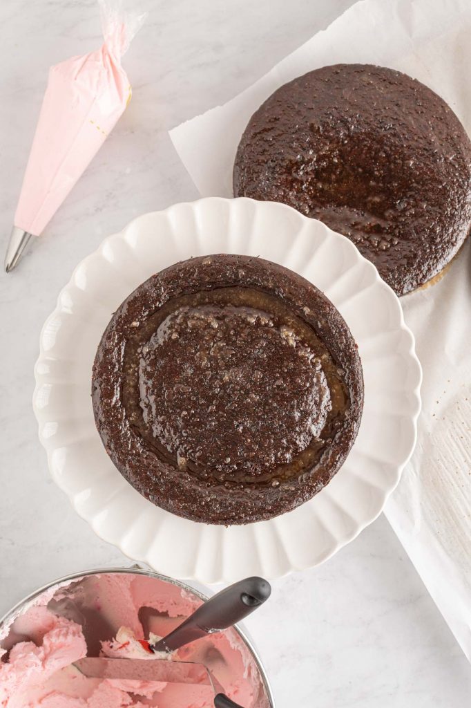 stacking the cakes on a cake stand