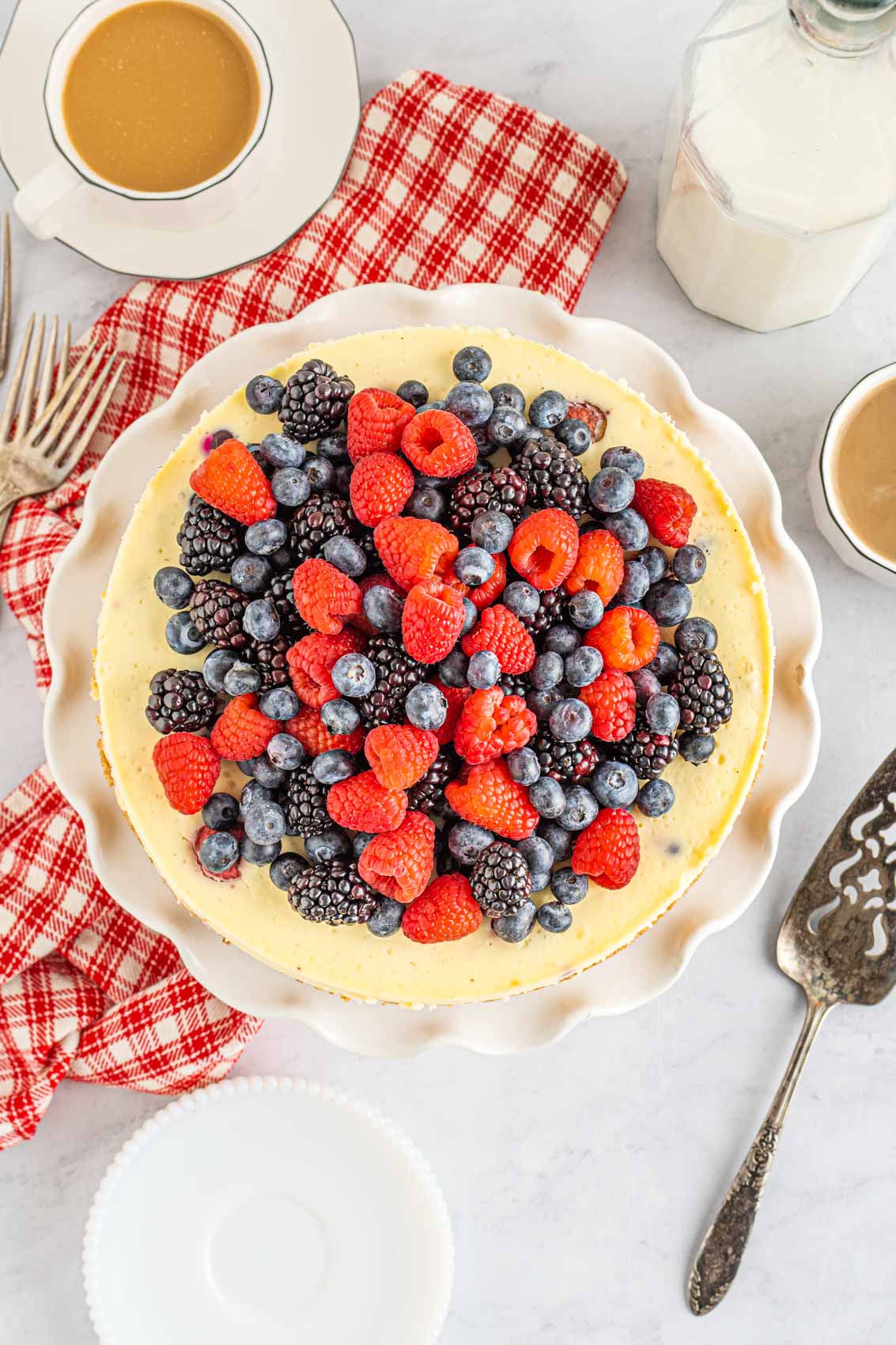overhead view of cheesecake with berries on top