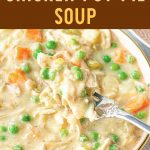 chicken pot pie soup in a bowl with a fork