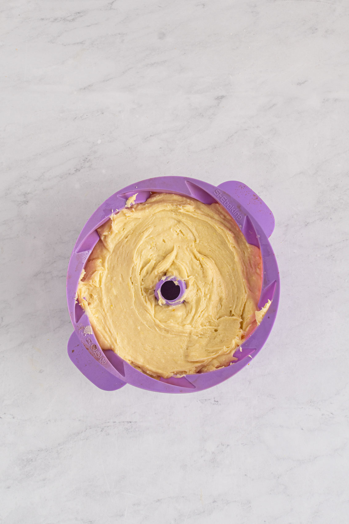 cake batter in a silicone bundt cake pan