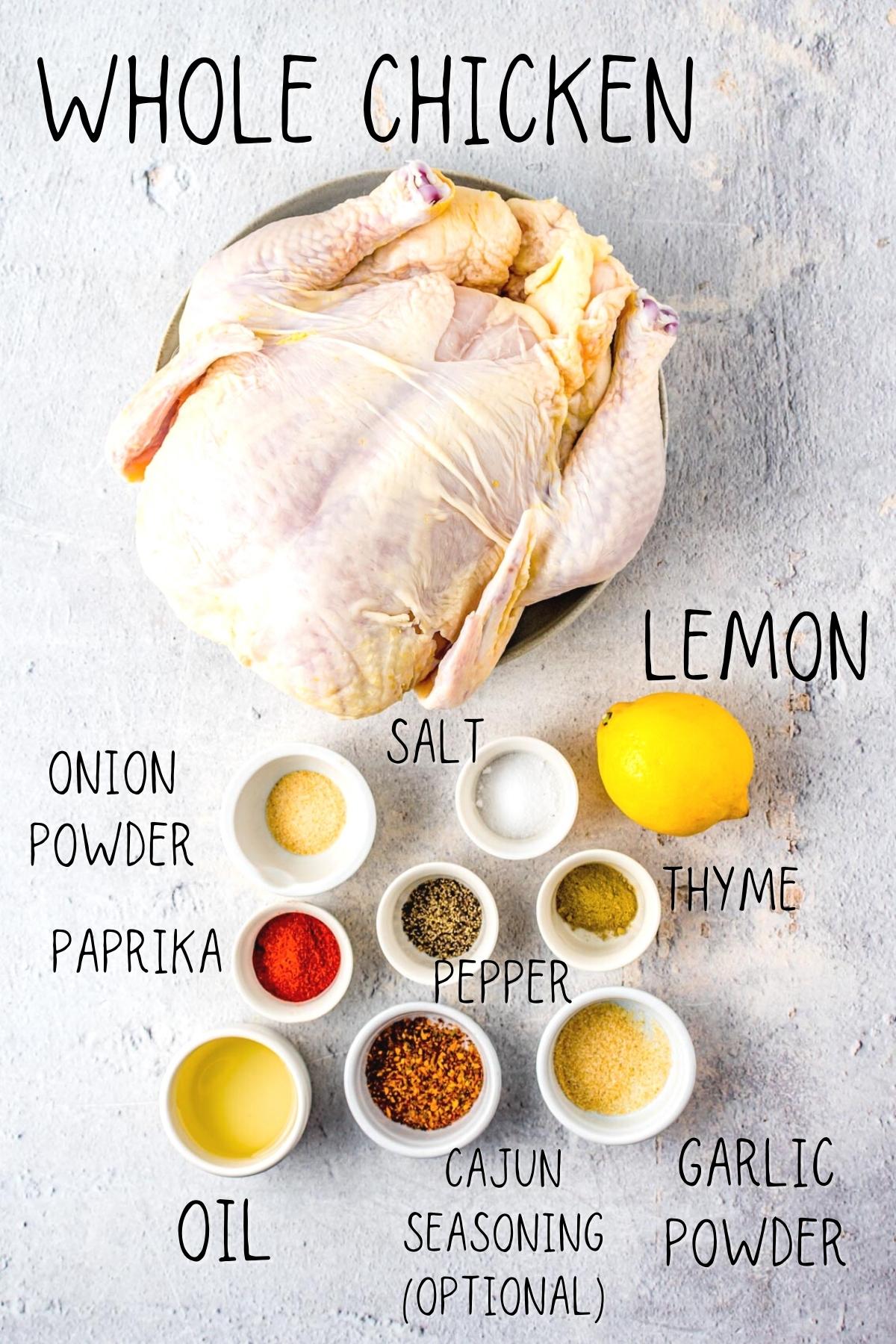 whole air fryer chicken recipe ingredients including a chicken, paprika, garlic powder, onion powder, thyme and oil