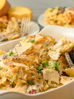 cajun chicken pasta in a serving dish with fork