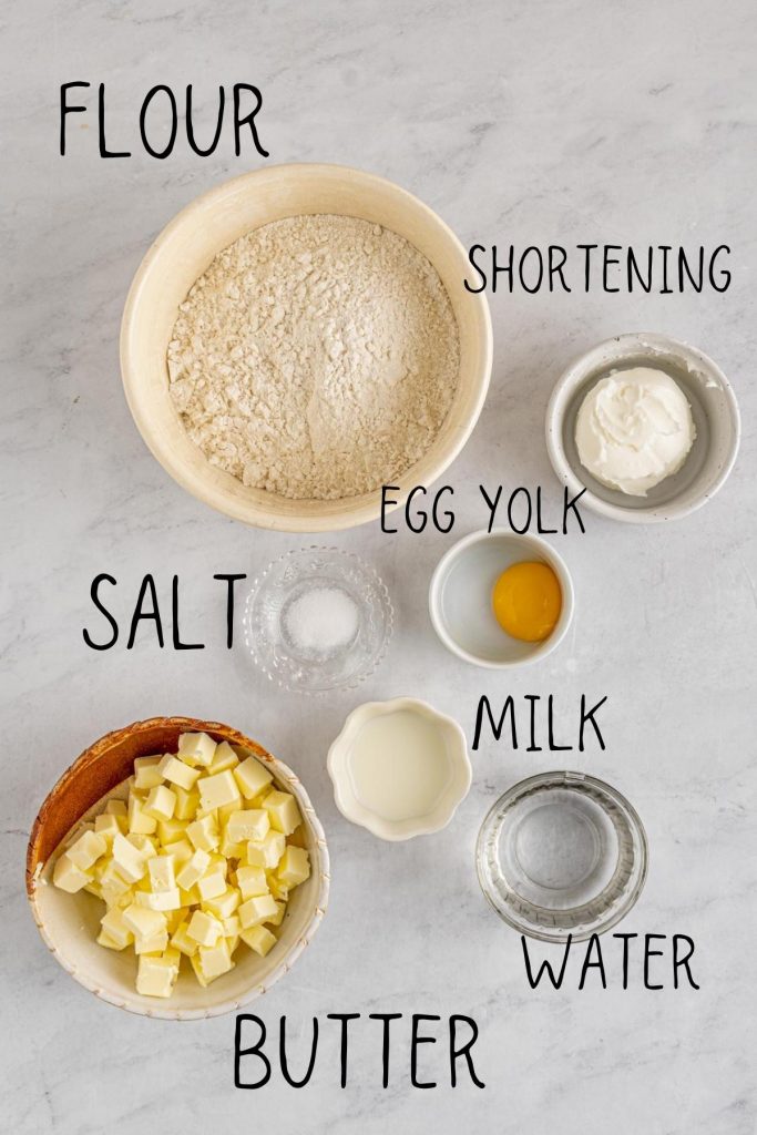 ingredients for custard tartlet filling, including butter, water, flour, shortening, egg yolk, salt, milk and water