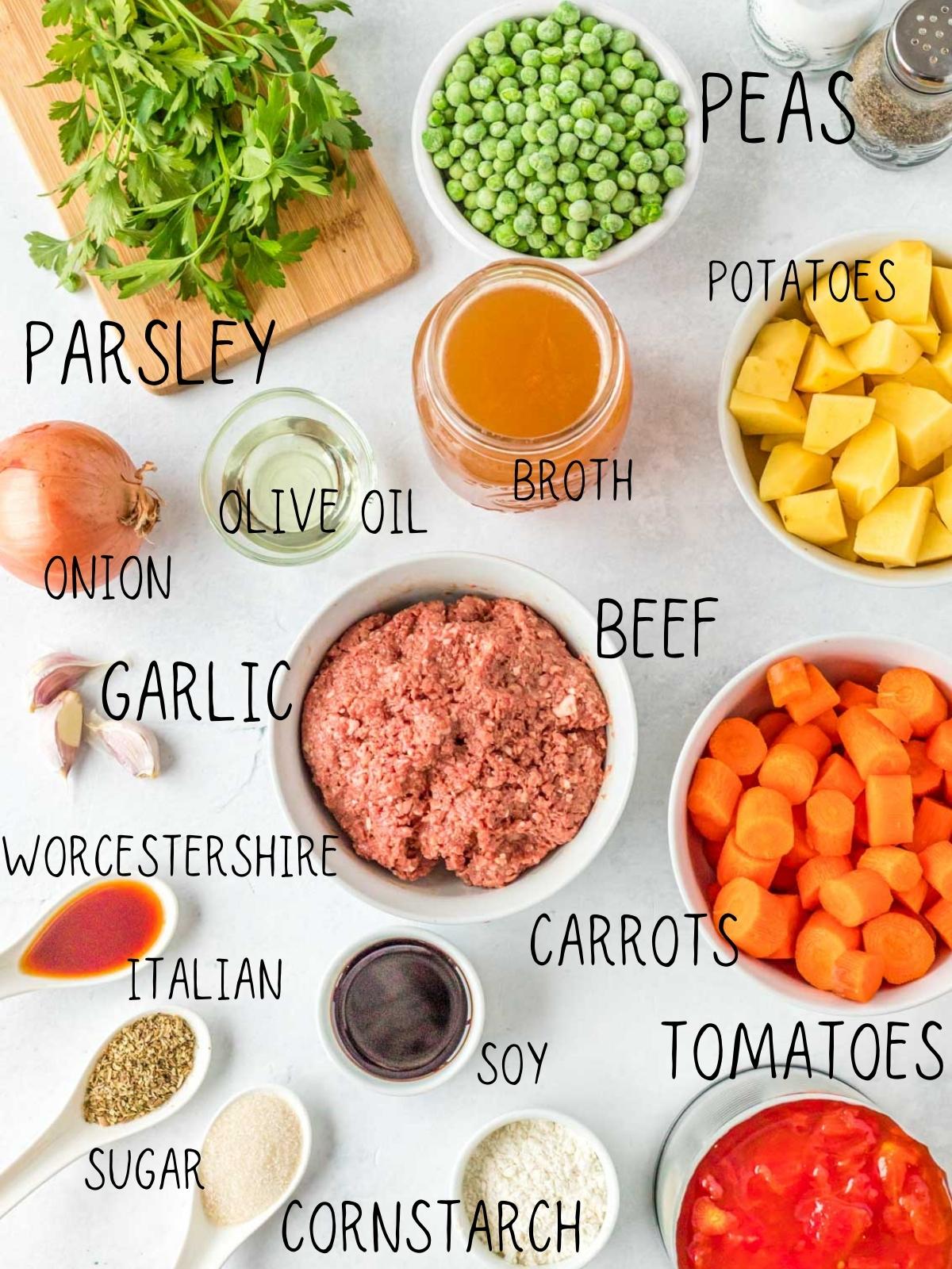 ingredients for instant pot beef veggie stew, including carrots, ground beef, potatoes, tomatoes, peas, Italian seasoning blend