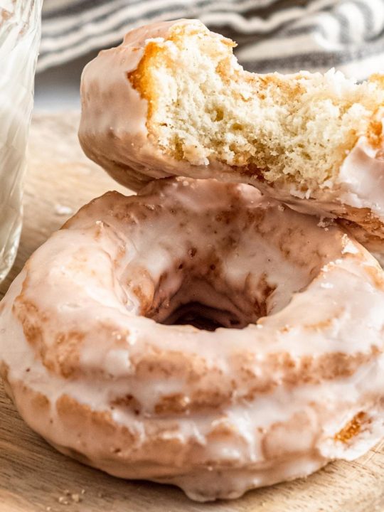 old fashioned, crackled sour cream donuts with a glass of milk
