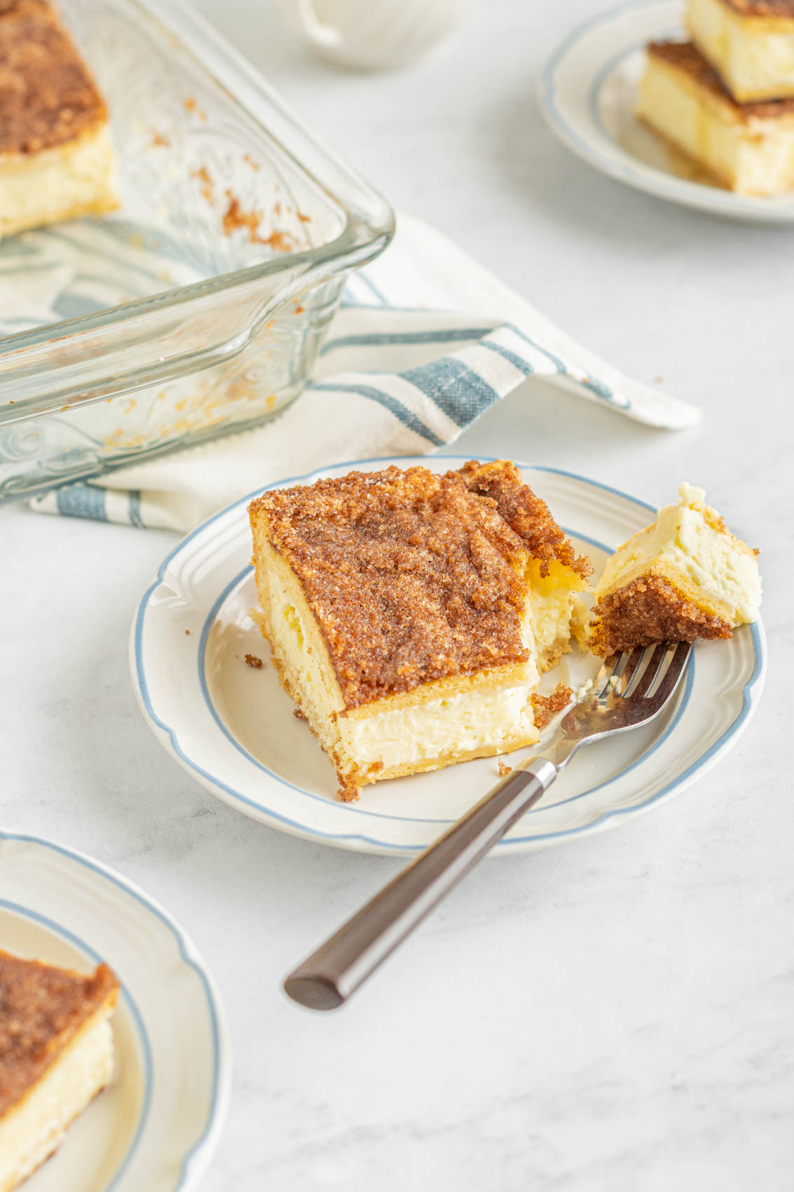 slice of sopapilla cheesecake with a fork on a plate