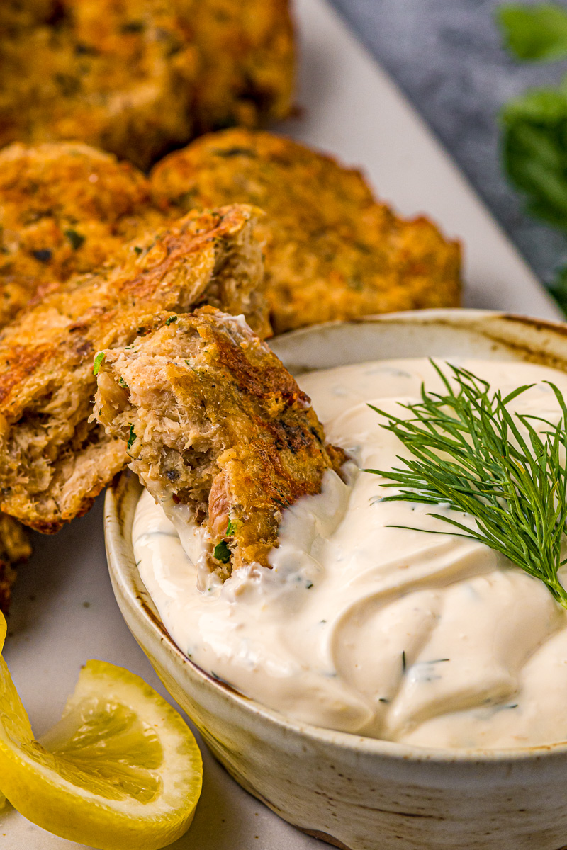 salmon patty broken in half, revealing thick insides