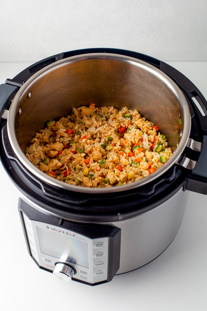 instant pot cooker with chicken fried rice inside