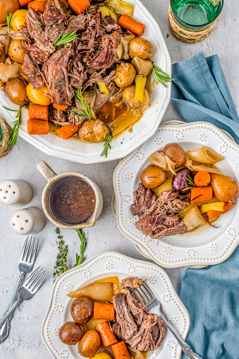 pot roast with veggies, rosemary and thyme as garnish