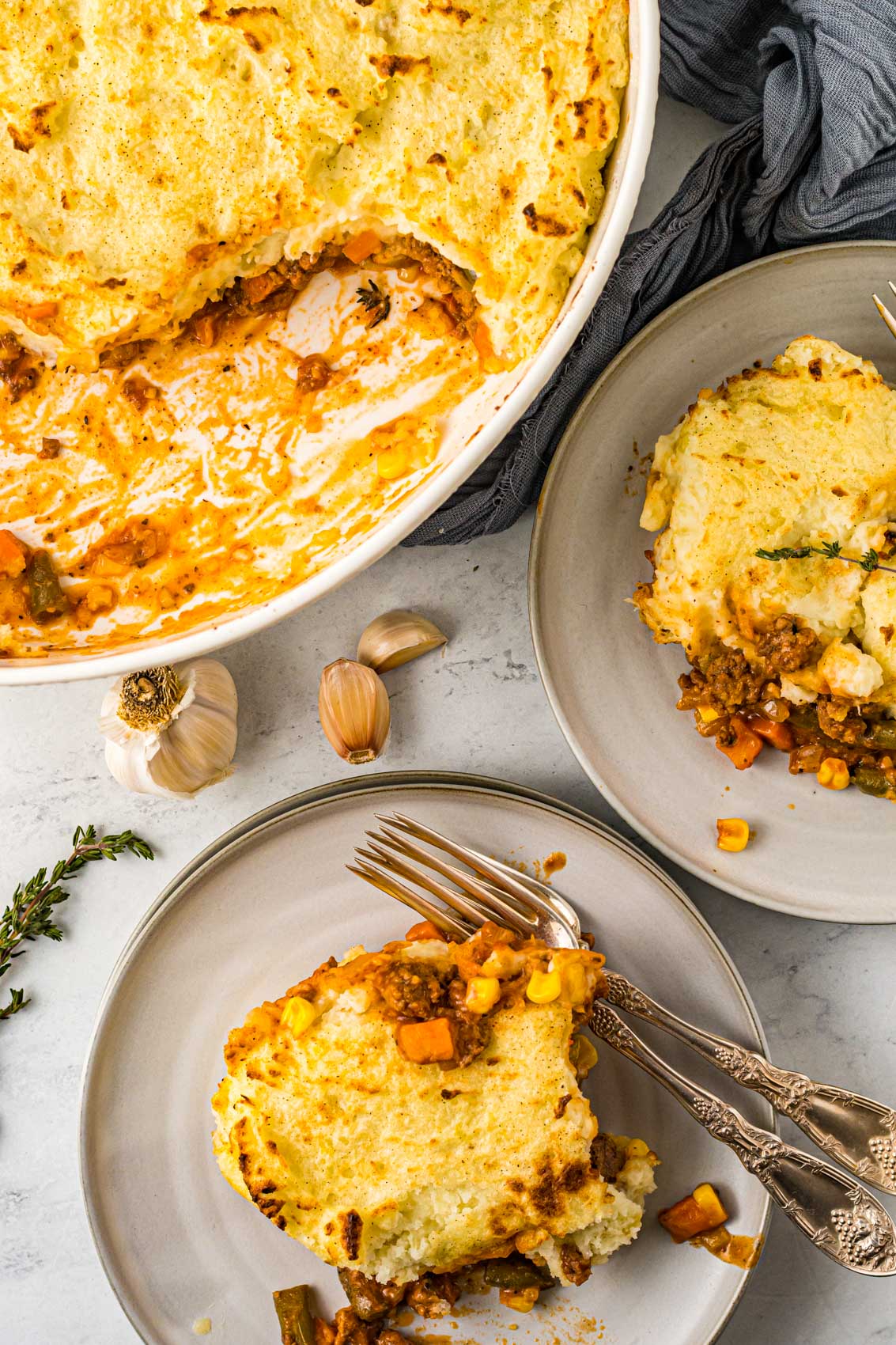 plates with forks and shepherds pie