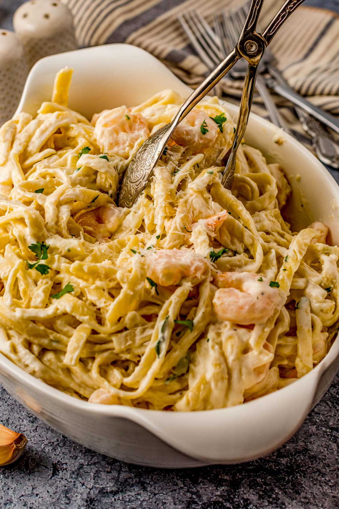 tongs with shrimp Alfredo