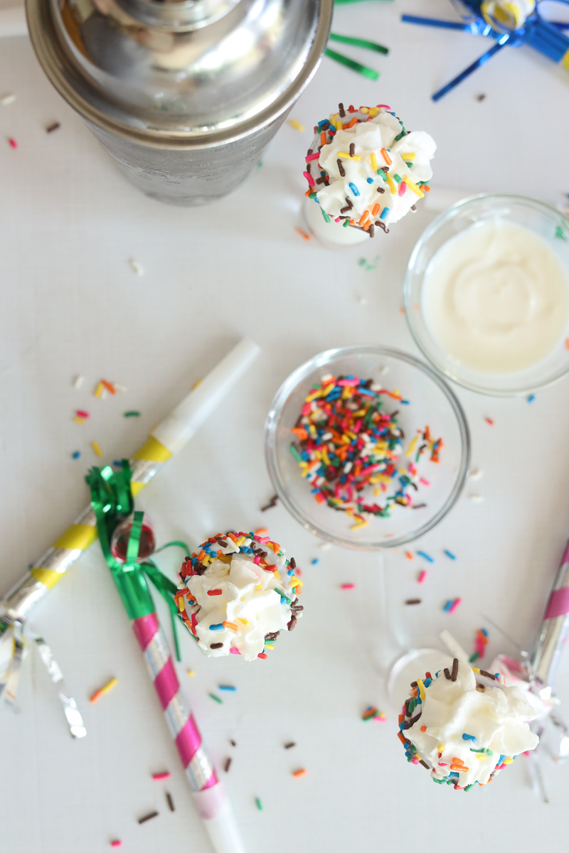 birthday cake shots with frosting, sprinkles and kazoos