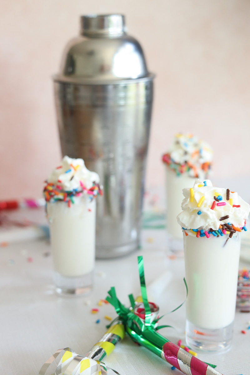 birthday cake shots with whipped cream and sprinkles