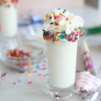 birthday cake shot with whipped cream and sprinkles