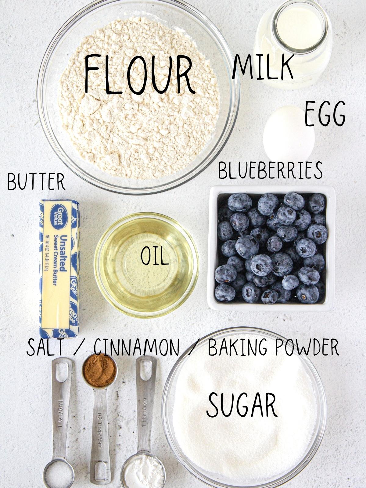 ingredients for starbucks muffins, including blueberries, butter, sugar, flour, milk, cinnamon and egg