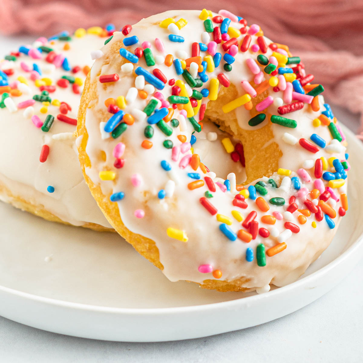 two donuts with frosting and sprinkles