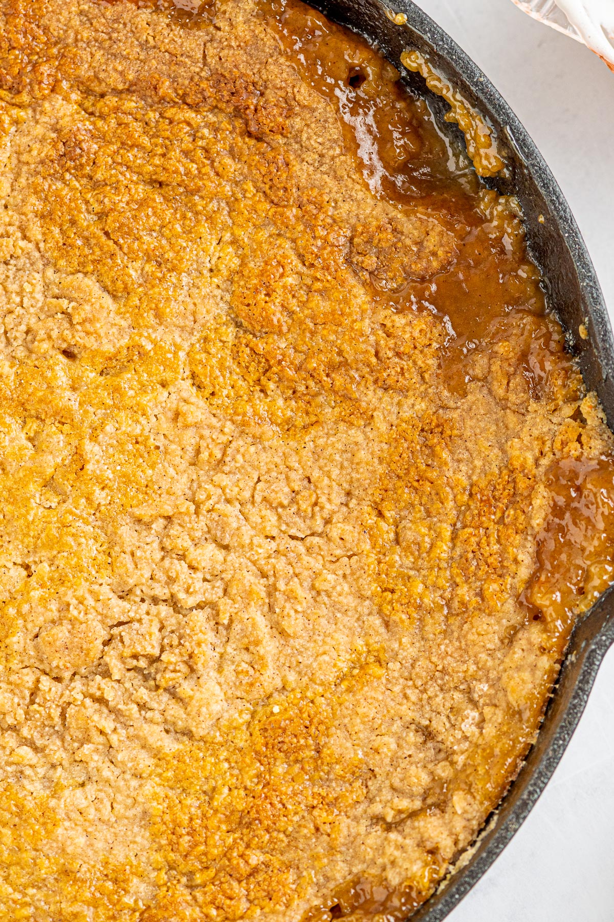 crisp golden crust of a peach cobbler