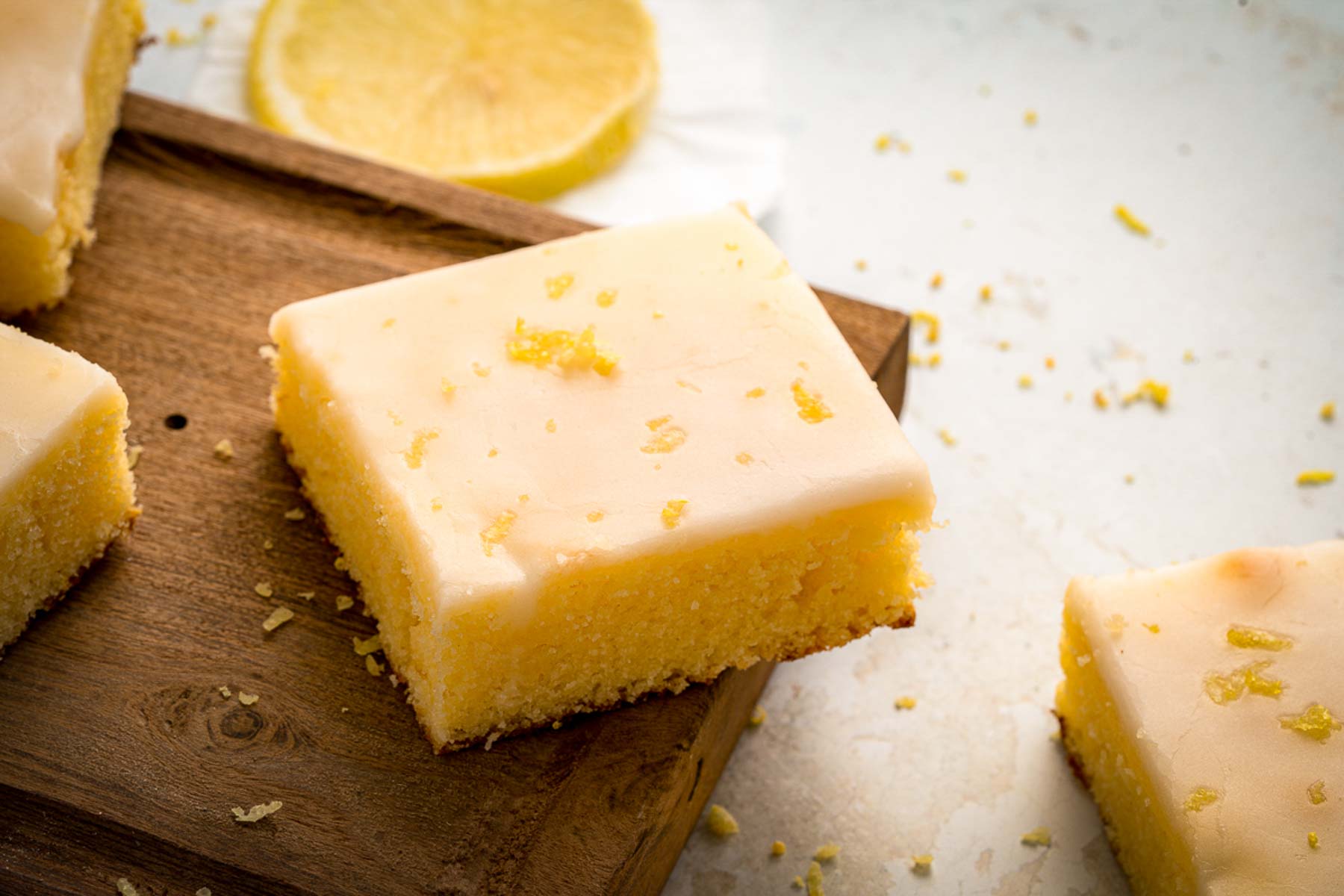 moist lemon brownies with glaze and lemon zest