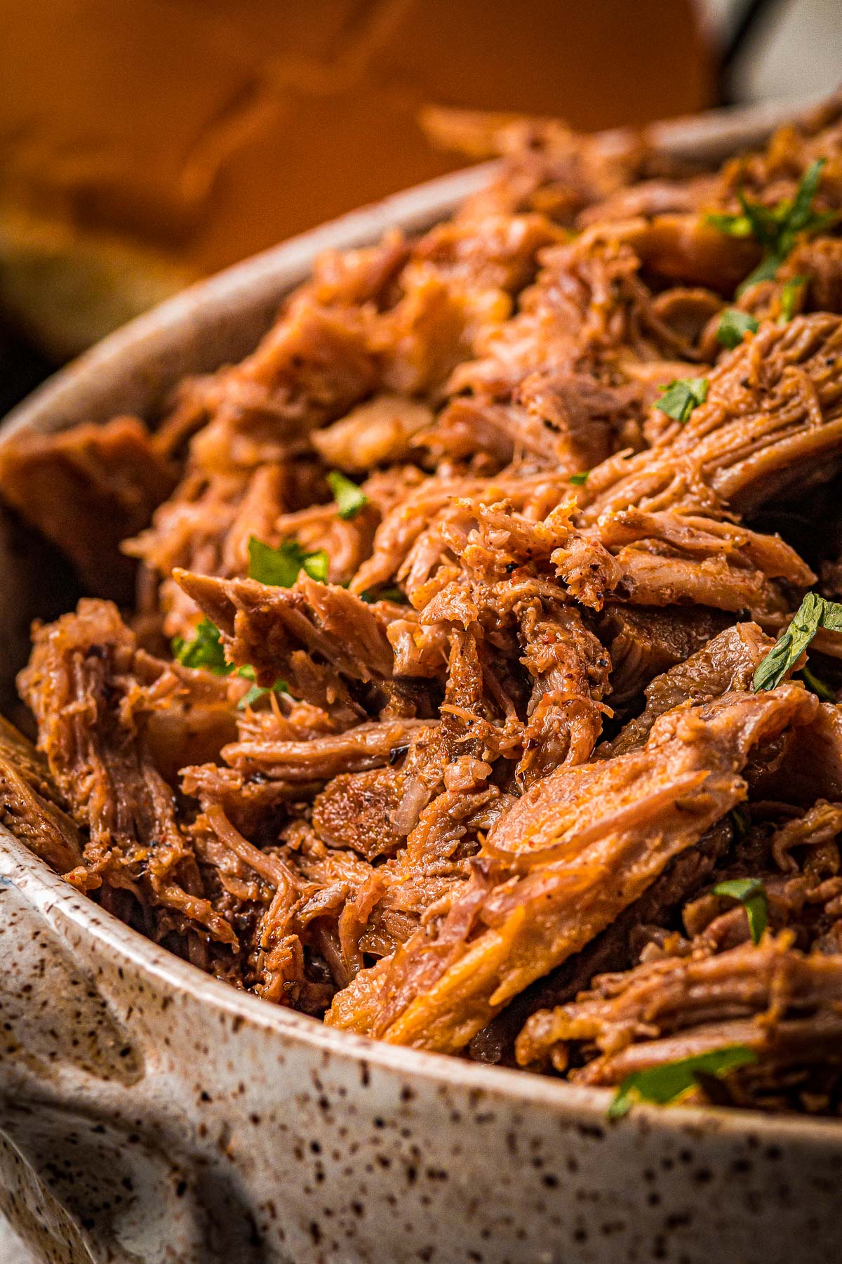 juicy Mexican pulled pork with cilantro garnish