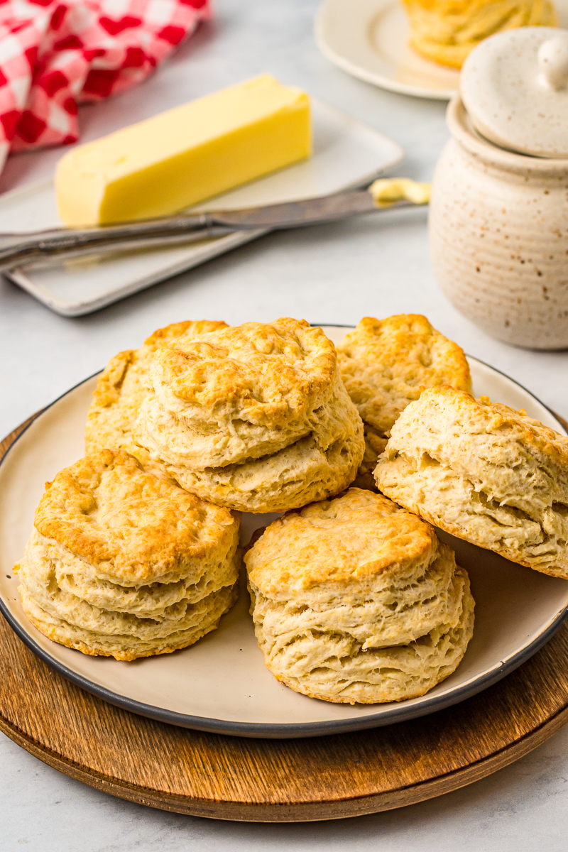 pile of large buttermilk biscuits with butter