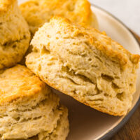 large pile of flakey buttermilk biscuits