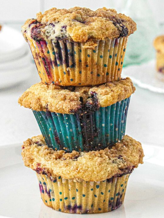 3 blueberry muffins stacked on top of one another